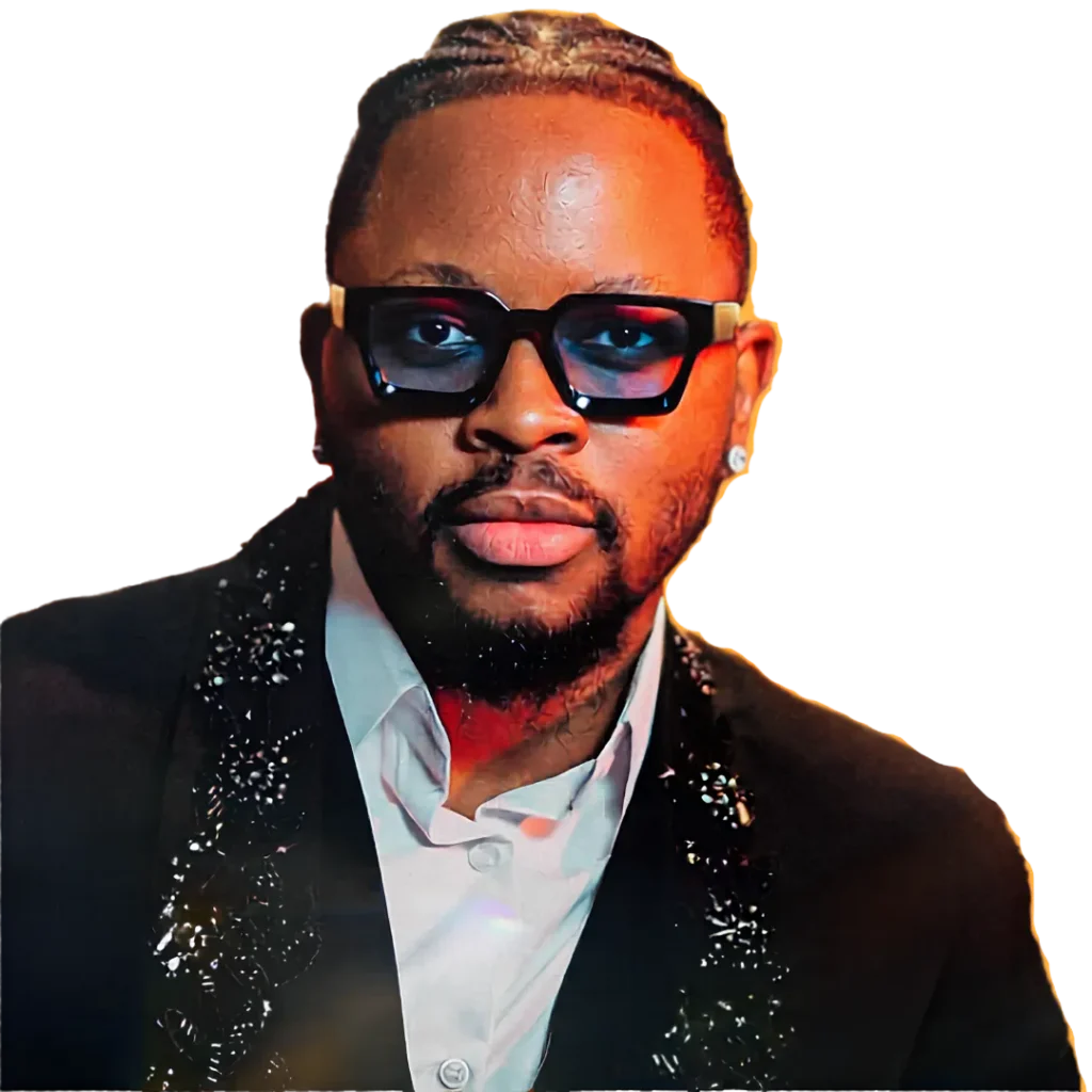 Portrait of Dr. Fola David wearing sunglasses and a stylish black jacket.