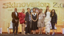 Elegant group photo on stage at the Skinnovation 2.0 award event. Skinnovation 2.0 award event group photo on stage.