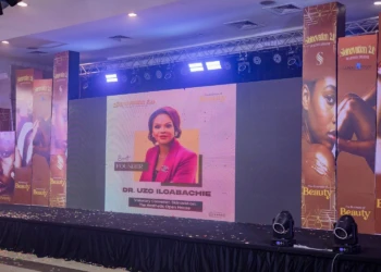Skinovation 2.0 beauty conference stage featuring Dr. Uzo Iloabachie and skincare branding. Skinovation 2.0 beauty conference stage with Dr. Uzo Iloabachie and skincare branding.